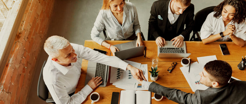 businessmen-handshaking-during-corporate-meeting-s-2024-10-31-22-08-58-utc
